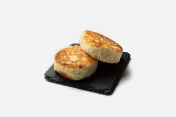 Curd cheesecakes, fried cheesecakes. Cheesecakes on a white background for insulation