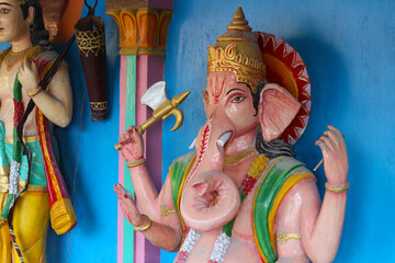 Sculptures of the gods. Ganesha at the Hindu Temple in Rishikesh, India. Vertical photo.