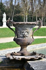 Beautiful Antique Bronze Vases in Gardens of Versailles palace, Paris