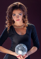 Young woman with a glowing ball..