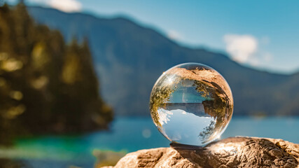 Crystal ball alpine summer landscape shot at the famous Eibsee lake near Garmisch-Partenkirchen, Bavaria, Germany