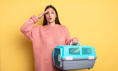 pretty woman looking happy, astonished and surprised. pet carrier concept