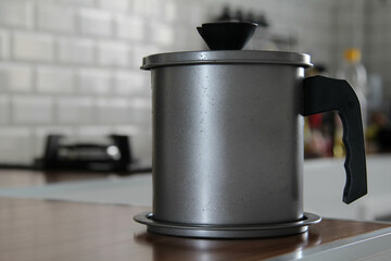 A stainless steel pot on modern counter.