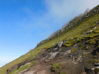 Obraz premium Exploring the stunning lush scenery on the green Faroe Islands