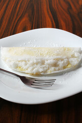 Brazilian food called Tapioca. Tapioca stuffed with coconut and condensed milk