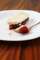 Guava paste and cheese. Closeup in a portion on the fork of guava paste and white cheese.