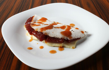 Tapioca with white cheese melted and guava paste. Brazilian dessert.