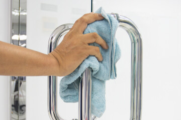 Prevention cleaning Door handles by Disinfectant solution for killing coronavirus on touching...