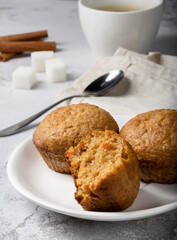 Carrot sweet muffins. Carrot cupcakes with sugar and cinnamon on a light background