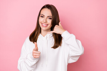 Photo of young girl happy positive smile call phone point finger you sign isolated over pink color background