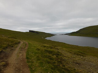 Fototapeta na wymiar The beautiful Atlantic coastline and islets on the Faroe Islands