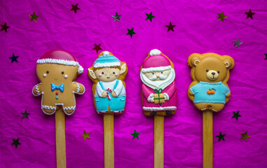Santa Claus, elf, Gingerbread man, bear characters Cookies on sticks on fuchsia dark pink...