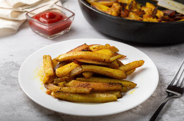 Fried potatoes with onions. Rustic potatoes with onions. traditional russian food