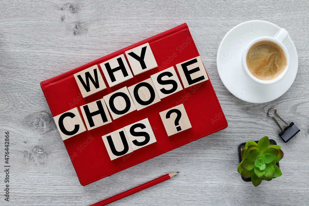 Poster why choose us? text on wood cubes on red notepad