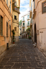 Fototapeta na wymiar Narrow colorful streets with house altars, laundry in Salerno, Italy