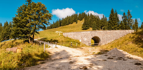 High resolution stitched panorama of a beautiful alpine summer view with a stone bridge near the...