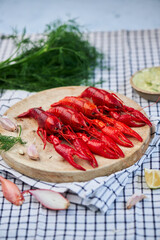 River Cooked Red Crawfish. Boiled crayfish with dill on wooden background