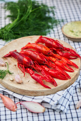 River Cooked Red Crawfish. Boiled crayfish with dill on wooden background