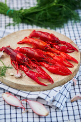 River Cooked Red Crawfish. Boiled crayfish with dill on wooden background