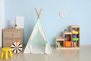 Stylish interior of modern children's room with play tent © Pixel-Shot