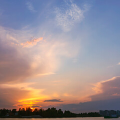 Fototapeta na wymiar beautiful cirrus clouds illuminated by the setting summer sun