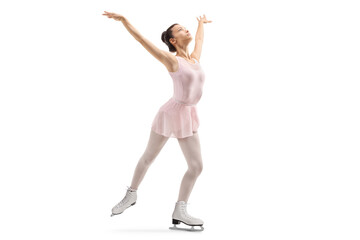 Young female in a pink dress performing ice skating