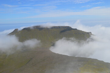 The view from the green mountains over the Faroe Islands and the Atlantic Sea