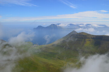 Fototapeta na wymiar The view from the green mountains over the Faroe Islands and the Atlantic Sea