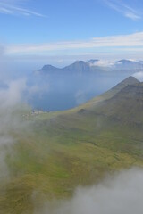 The view from the green mountains over the Faroe Islands and the Atlantic Sea