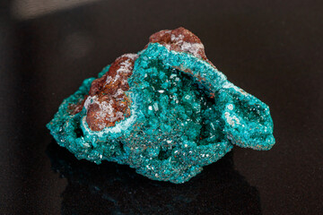 macro mineral stone Dioptase on a gray background