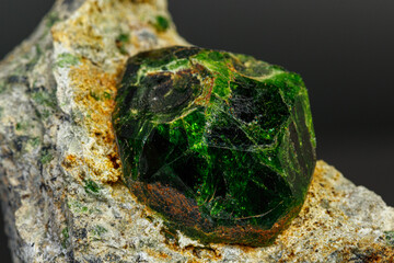 macro mineral stone Andradite on a black background