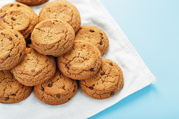Oatmeal cookies on a napkin on a blue background