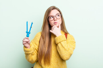 redhair thinking, feeling doubtful and confused. compass draw concept