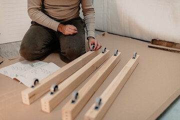 A man assembling new furniture bought for home