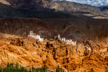 Basgo monastery - built under massive stones and rocks of Leh, Ladakh, Jammu and Kashmir, India. Shot under dramatic light iof ladakh. Daytime image. - obrazy, fototapety, plakaty