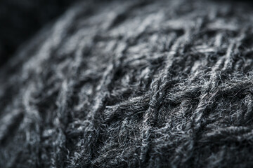 Gray threads of natural wool close-up in full screen.