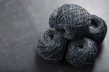 Tangles of gray yarn made of natural wool close-up
