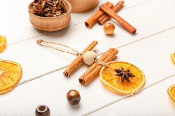 Handmade Christmas toys on white wooden background