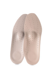 Beige orthopedic insoles on white background