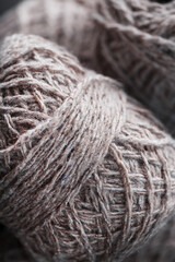 Light brown wool yarn made of threads in tangles.
