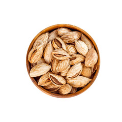 Top view of roasted brown almond nuts in cracked shell in wooden bowl isolated on white background.