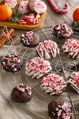 Grid with tasty candy cane cookies on table, closeup