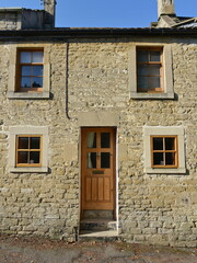 Fototapeta na wymiar Old stone cottage house