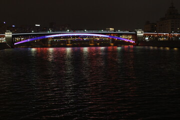 Fototapeta na wymiar Smolenskaya embankment, view of the Borodinsky bridge. Moscow, Russia.