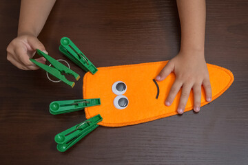 The child's hands. Development of fine motor skills through games. Montessori method, tools.