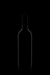 Beautiful bottle with glare on the sides on a black background, black on black