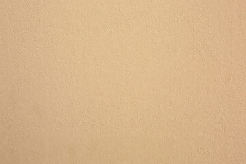 The concrete wall is beige. Rough texture for the background.
