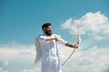 Happy Valentines Day. Crazy bearded angel man aiming with the arrow.
