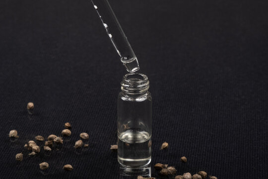 pipette with hemp oil, a drop of essential oil from marijuana seeds.
