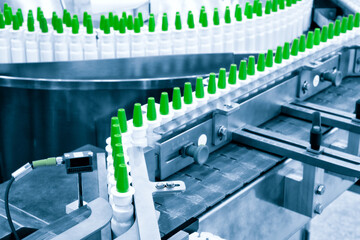 Close-up Many white plastic spray bottles for packaging liquid medicines or cosmetics in a row on a...